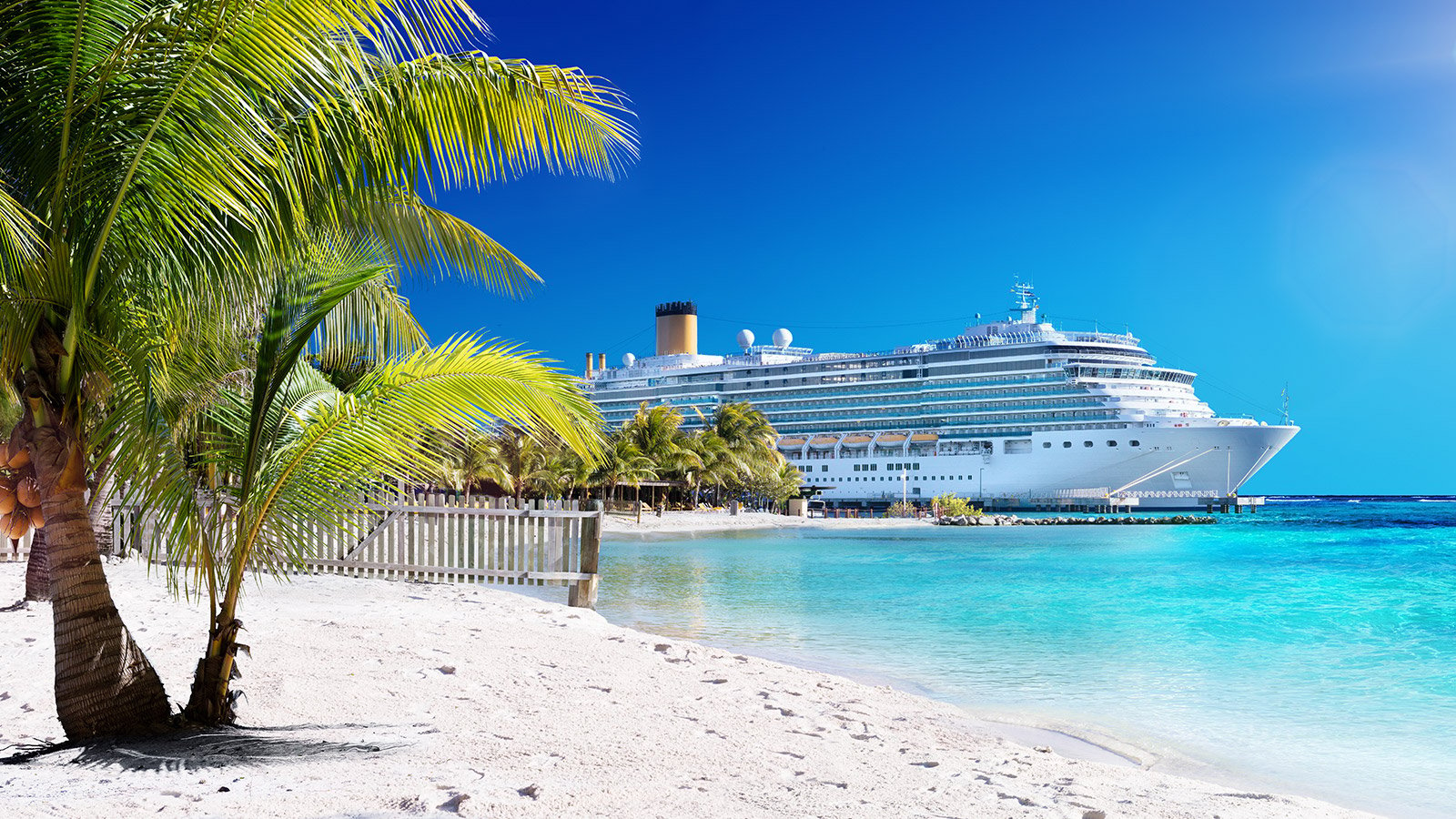 cruise ship on tropical beach