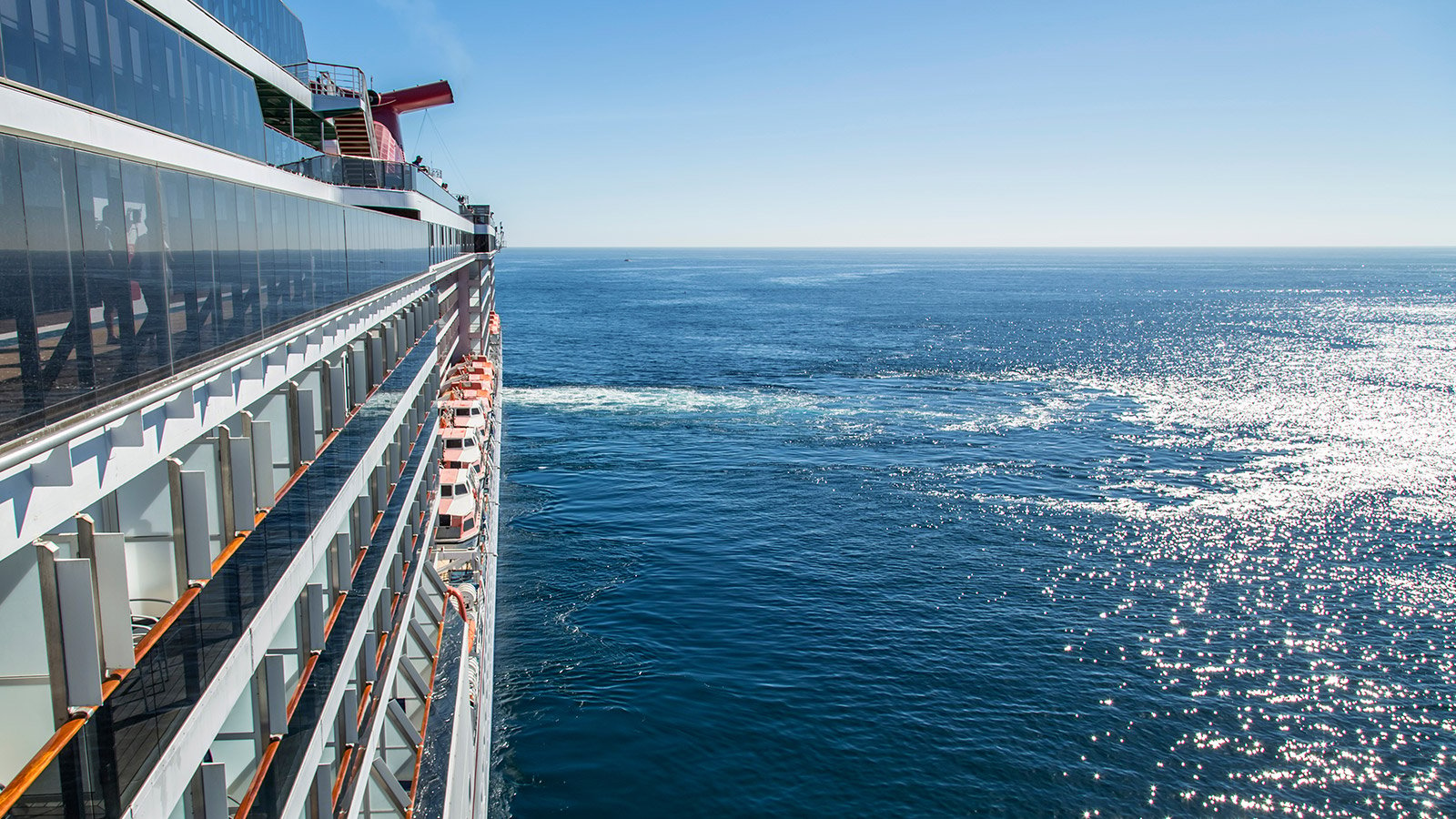 side of cruise ship on open ocean