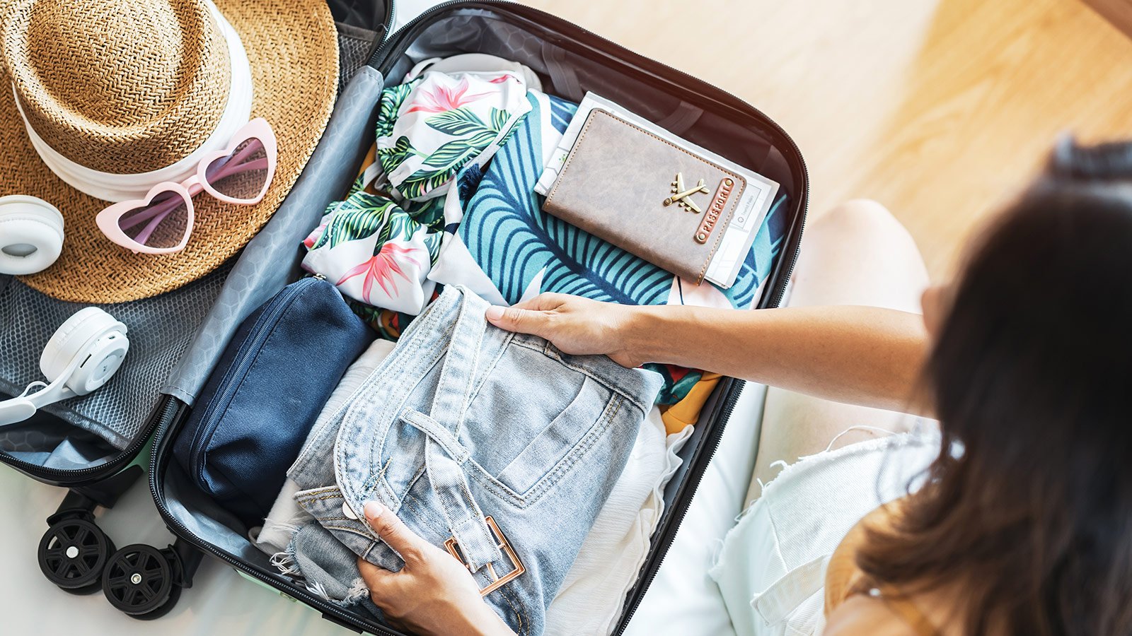 woman packing her suitcase for a vacation