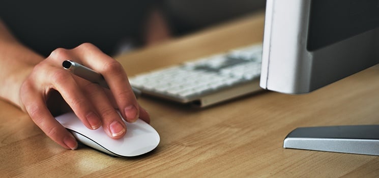 Close-up of hand on computer mouse